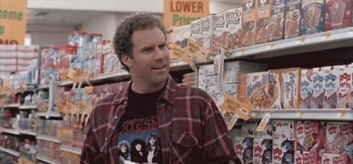 Man in grocery store aisle with cereal boxes