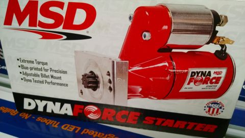 1985 Jeep CJ7 - A close-up of a red MSD DynaForce starter with a chrome top, featuring text that reads "Extreme Torque," "Blue-printed for Precision," "Adj…