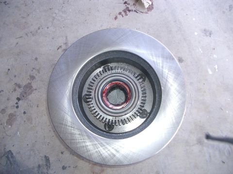 1994 Ford Bronco - Close-up of a brake rotor and hub assembly, showing the bearing and part numbers.
