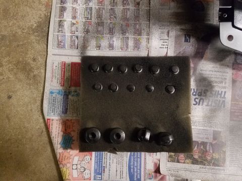 1993 Ford Probe - Hardware is arranged on newspaper, with some pieces receiving a coat of black paint.