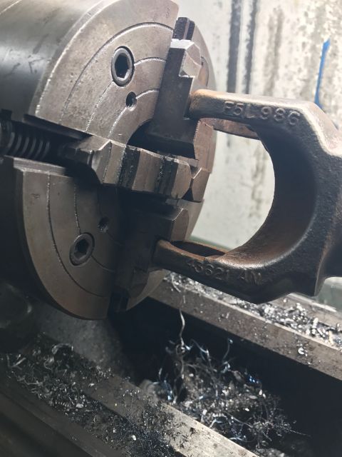 1996 Ford Bronco - Machining a part on a lathe, with visible stamping 'F5L986' and '43621 4W'.