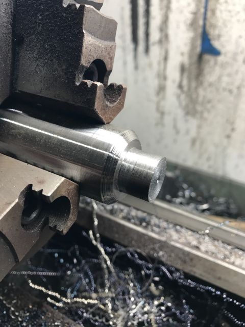 1996 Ford Bronco - Machining a metal shaft on a lathe, creating custom parts.