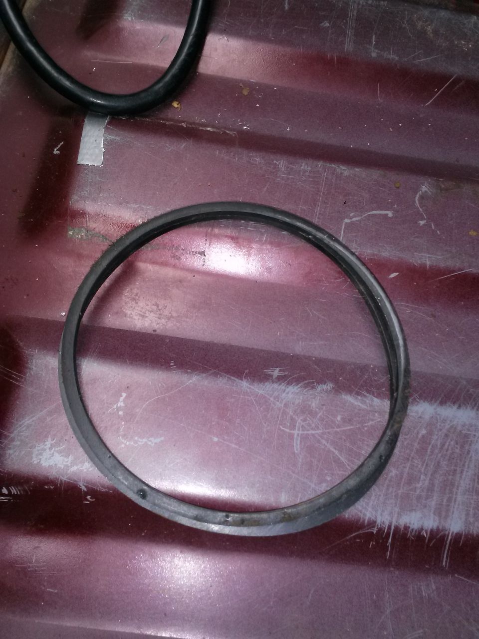 rubber ring on maroon surface