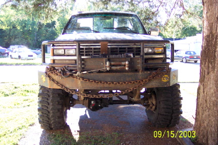 1979 Ford Bronco - This truck has been outfitted with a custom bumper, winch, and large off-road tires.
