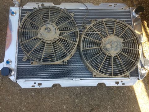 1988 Ford Bronco - Aluminum radiator assembly two electric cooling fans, likely an aftermarket upgrade.