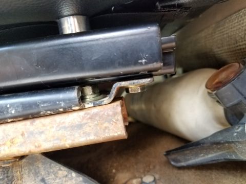 1988 Ford Bronco - Close-up view of a seat mounting bracket, with the Supermotors.net logo visible in the lower right corner.