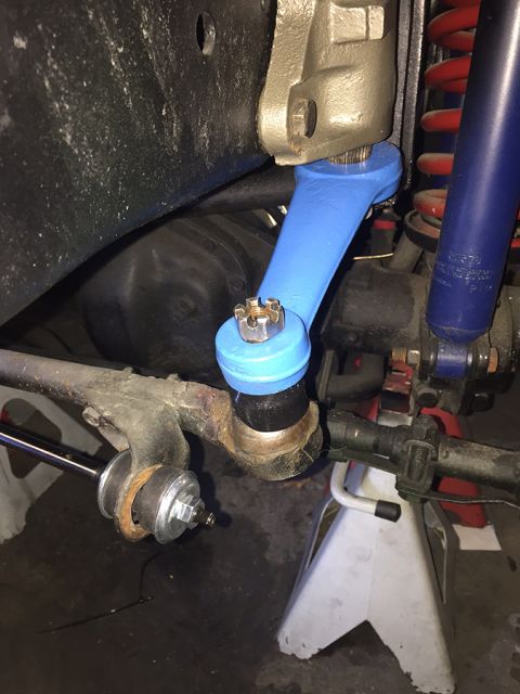 1978 Ford Bronco - The photo shows a close-up view of a vehicle's steering and suspension components, including a bright blue painted part.