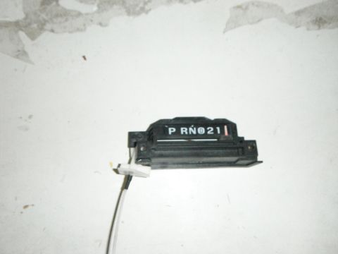 1990 Ford Bronco - A gear shift indicator with P R N 0 2 1 labels and an attached cable is shown against a white background.