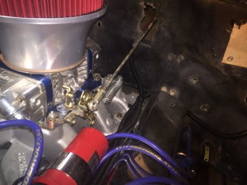 1982 Ford Bronco - Engine bay detail showing a Holley carburetor with a red air filter and blue spark plug wires.