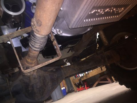 1982 Ford Bronco - This photo shows the underside of a vehicle, focusing on the drivetrain components and suspension system.