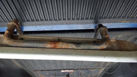 1994 Ford Bronco - Close-up of a rusted running board bracket, likely from a truck or SUV.