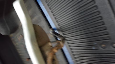 1994 Ford Bronco - Close-up view of a vehicle's running board and floor mat.