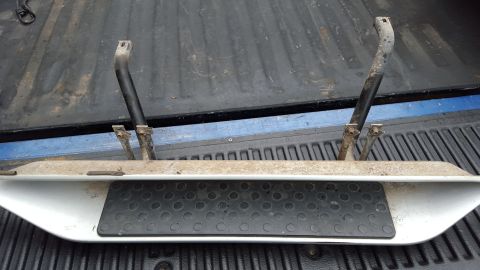 1994 Ford Bronco - A pair of vehicle running boards with textured step pads are shown, likely for sale or transport.