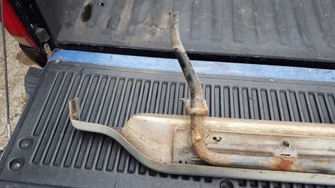 1994 Ford Bronco - A rusty running board part is shown, likely for an older vehicle.