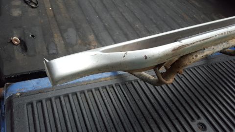 1994 Ford Bronco - A single running board is shown resting in the bed of a pickup truck.
