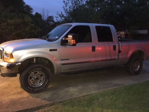 2004 Ford F-150 - This silver 2004 Ford F-150 pickup truck is shown from a 3q-front angle.