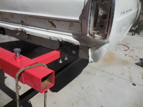 1966 Ford Fairlane - Rear view of a 1966 Ford Fairlane undergoing repairs, showing the taillight and bumper area.