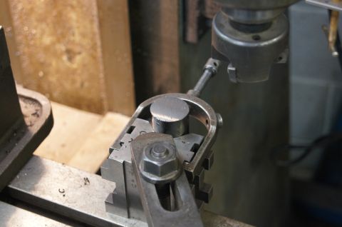 1979 Ford Bronco - Close-up of a metal part being machined on a milling machine.