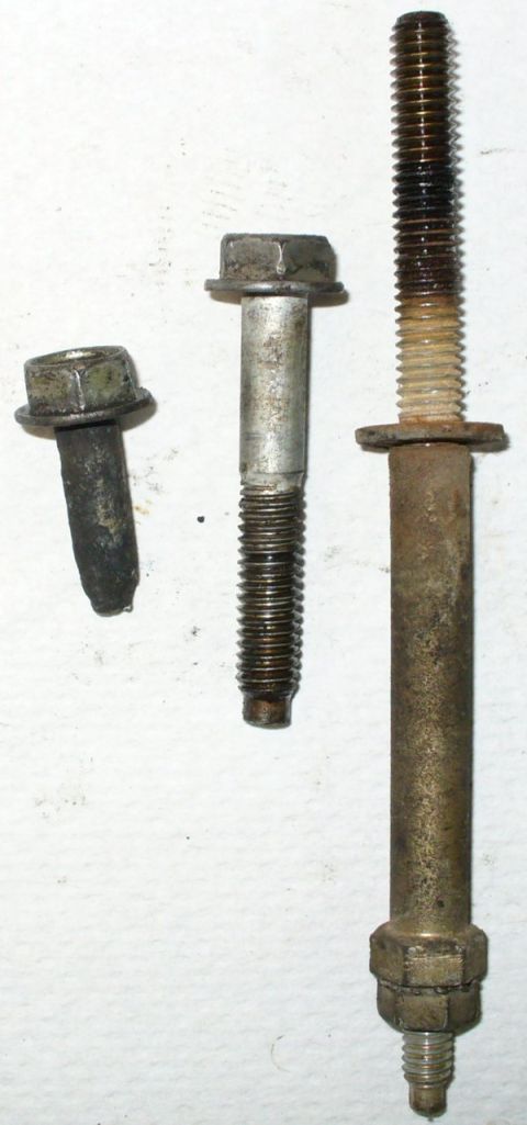 1992 Ford Bronco - Lower manifold bolts. Inners all came out easily, but 3 of the 4 corner bolts snapped in the same spot. Judging from the taper, they were h…