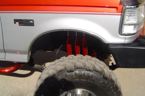 1993 Ford Bronco - Front fender and tire detail of a 1992 Ford F-250 XLT truck.