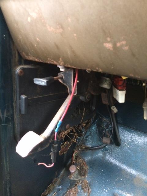 1979 Ford F-150 - Interior view of a vehicle's floor showing pedals and exposed wiring.