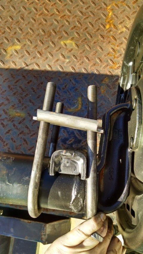 2016 Ford F-250 - Close-up of a U-bolt installation on a leaf spring, likely for a truck or heavy equipment.