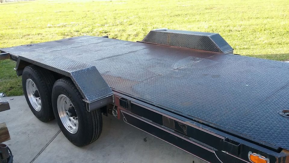 dual-axle car hauler trailer with diamond plate deck and fenders