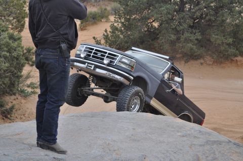1991 Ford Bronco - 1991 Ford Bronco navigating a challenging rocky terrain off-road.