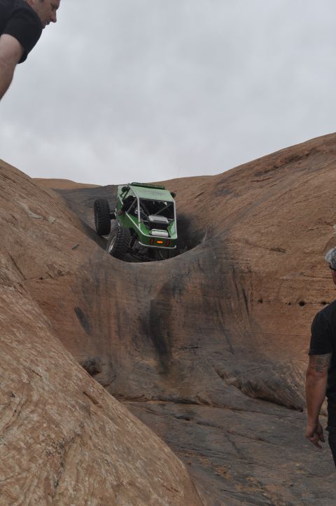 1991 Ford Bronco - This custom buggy navigates a challenging rock obstacle, its off-road capabilities.