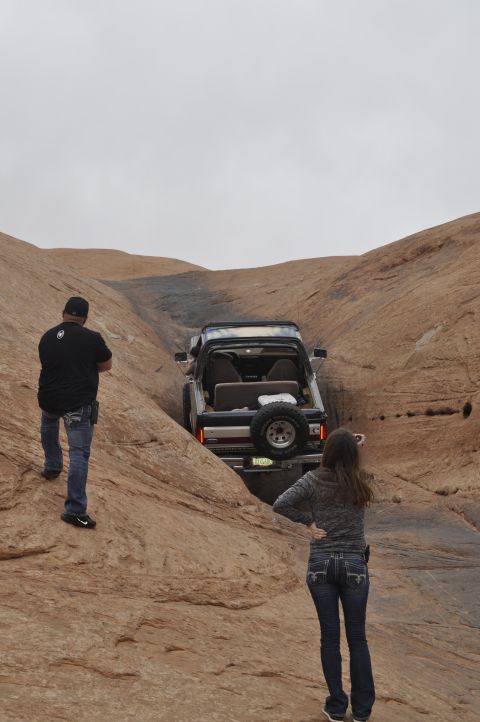 1991 Ford Bronco - A 1991 Ford Bronco is driven through a narrow canyon on an off-road trail.