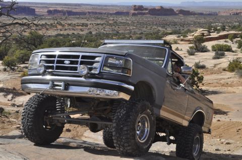 1991 Ford Bronco - This lifted 1992 Ford Bronco navigates a rocky desert landscape.