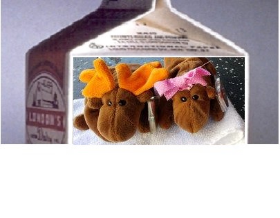1990 Ford Bronco - Plush moose toys with orange antlers and a pink bow are displayed on a towel.