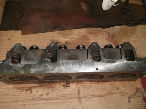 1964 Ford Galaxie - Engine cylinder head with valve springs is shown, likely a replacement part.