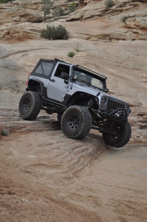 1991 Ford Bronco - This modified Jeep Wrangler JK navigates a challenging rocky terrain.