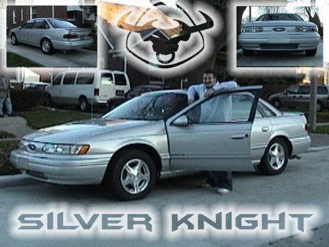 1995 Ford Taurus - A silver 1995 Ford Taurus sedan is shown with the driver's door open, a man leaning on it and the text 'SILVER KNIGHT' at the bottom.
