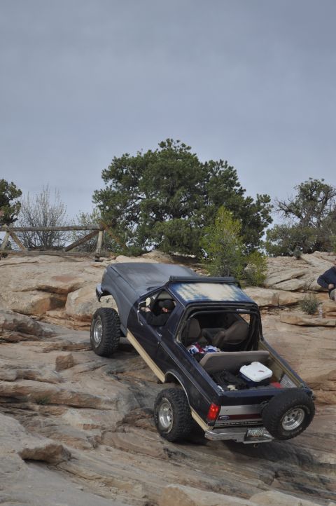 1991 Ford Bronco - 1991 Ford Bronco navigating a challenging rocky trail.