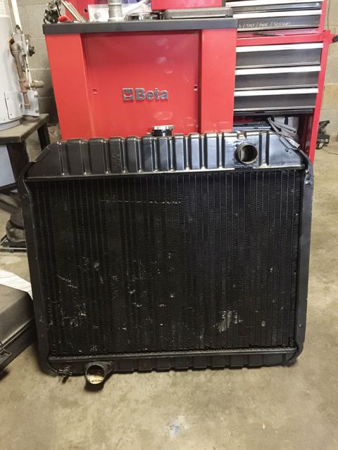 1978 Ford Bronco - Radiator part shown in front of a red Beta toolbox in a garage setting.