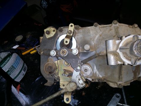 2007 Subaru Impreza - Close-up of a mechanical transfer case with visible linkages and springs, likely a vehicle part.