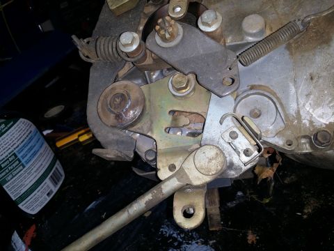2007 Subaru Impreza - Mechanical linkage assembly with springs and bolts, possibly from a tractor or other machinery.