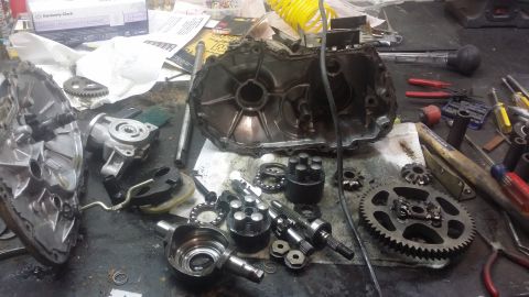 2007 Subaru Impreza - Transmission parts and tools are laid out on a workbench for repair or inspection.