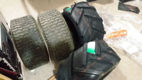 2007 Subaru Impreza - Two used lawnmower tires and two new tractor tires are shown.