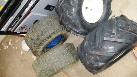 2007 Subaru Impreza - Several tractor tires are visible, some with aggressive tread patterns.