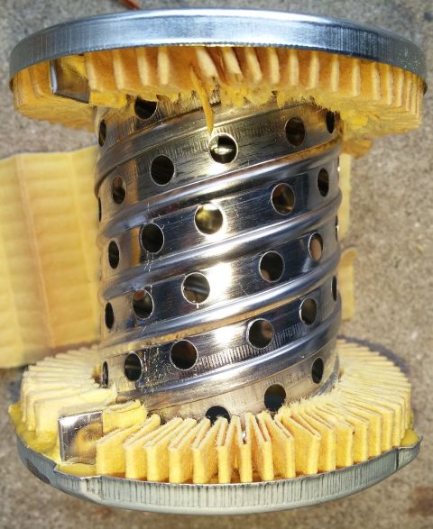 2000 Ford Crown Victoria - This oil filter has been cut open to reveal its internal components and filter media.