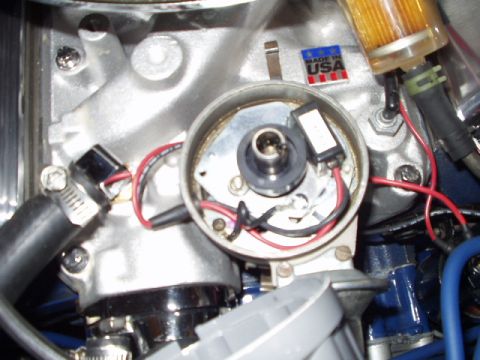 1967 Ford Mustang - This is a close-up view of an engine's distributor, showing internal components and wiring.