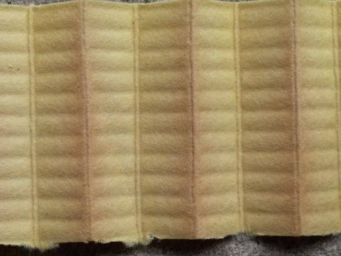 2000 Ford Crown Victoria - Close-up of oil filter media showing its pleated structure and signs of use.