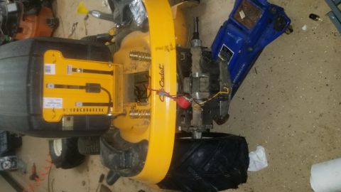 2007 Subaru Impreza - Close-up view of a Cub Cadet lawn tractor's engine and transmission components, showing mechanical components and wiring.