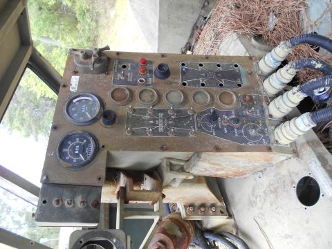1992 Ford Bronco - Dashboard panel with gauges and switches, likely from an older vehicle or piece of equipment.