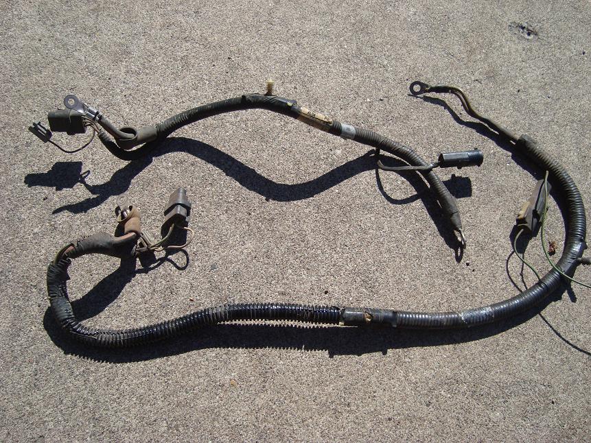 Long engine wiring harness with connectors laid on concrete