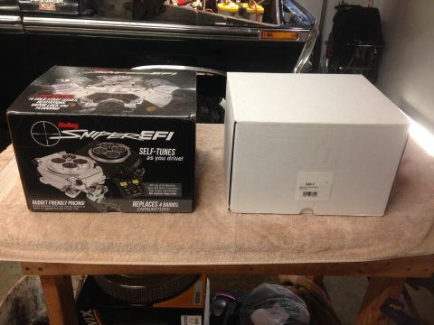 1979 Ford Bronco - Holley Sniper EFI self-tuning fuel injection system box and another box.