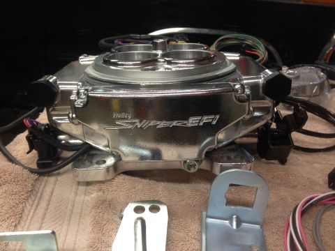 1979 Ford Bronco - Holley Sniper EFI throttle body is shown with its wiring and mounting hardware.